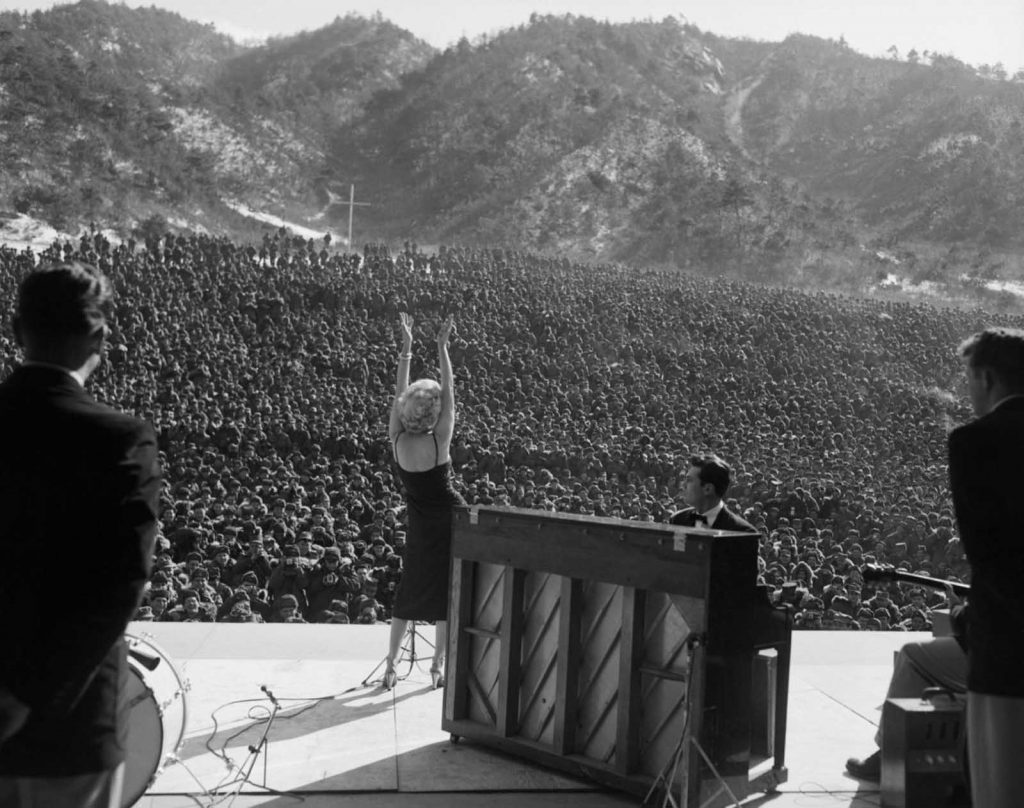 Marilyn Monroe singing in front of troops in Korea.