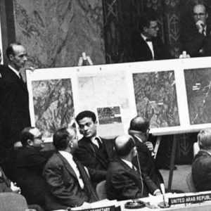 U.S. Ambassador to the United Nations, Adlai Stevenson, second from right, confronts Soviet delegate Valerian Zorin, first on left, with a display of reconnaissance photographs during emergency session of the U.N. Security Council at the United Nations headquarters in New York, on October 25, 1962.