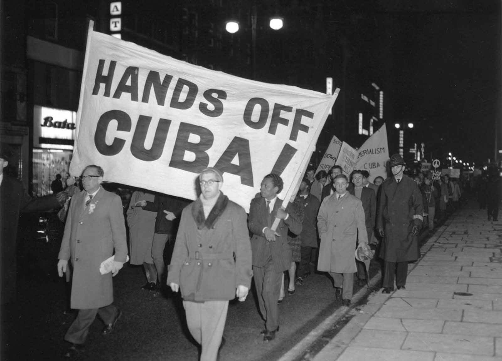 Members of the Campaign for Nuclear Disarmament (CND) march during a protest against the U.S. action over the Cuban missile crisis, on October 28, 1962 in London, England.