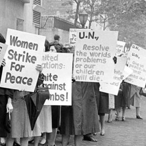 Picketers representing an organization known as Women Strike for Peace carry placards outside the United Nations headquarters in New York City, where the U.N. Security Council considers the Cuban missile crisis in a special meeting, on October 23, 1962.