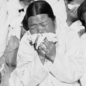 South Korean women weep as they listen to President Syngman Rhee speak at a memorial service in Seoul, October 17, 1953. The service honored the 33,964 South Koreans killed in the last year of the war.