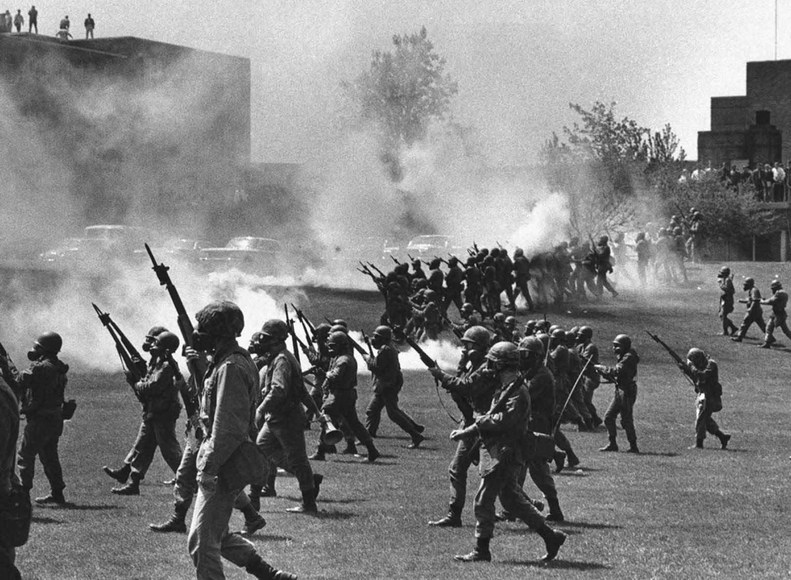 The Ohio National Guard moves in on rioting students at Kent State University in Kent, Ohio, on May 4, 1970. Four persons were killed and eleven wounded when National Guardsmen opened fire.