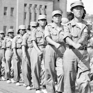 South Korean WACs trained and ready to join their men in the battle against Chinese invaders, display military precision as they parade through Pusan, main United Nations’ fort city in Korea, on September 12, 1950.